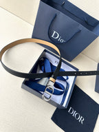 Leather belt with navy strap and tan stripe, with metal buckle detail