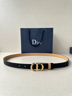 Leather belt with navy strap, tan stripe, and gold-tone CD buckle
