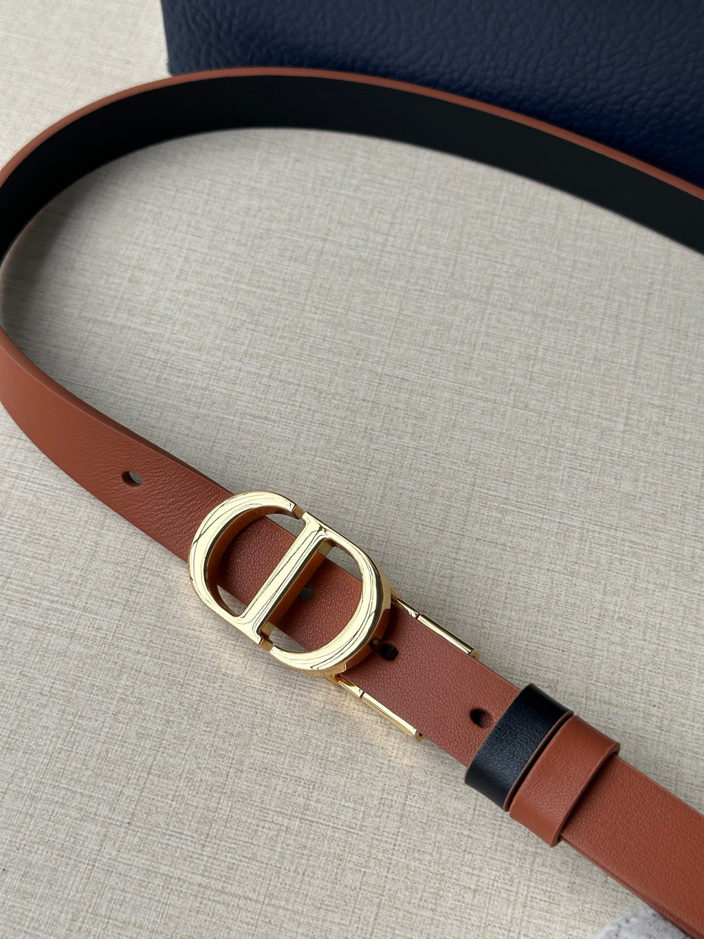 Dior leather belt with tan strap and oval gold-tone buckle
