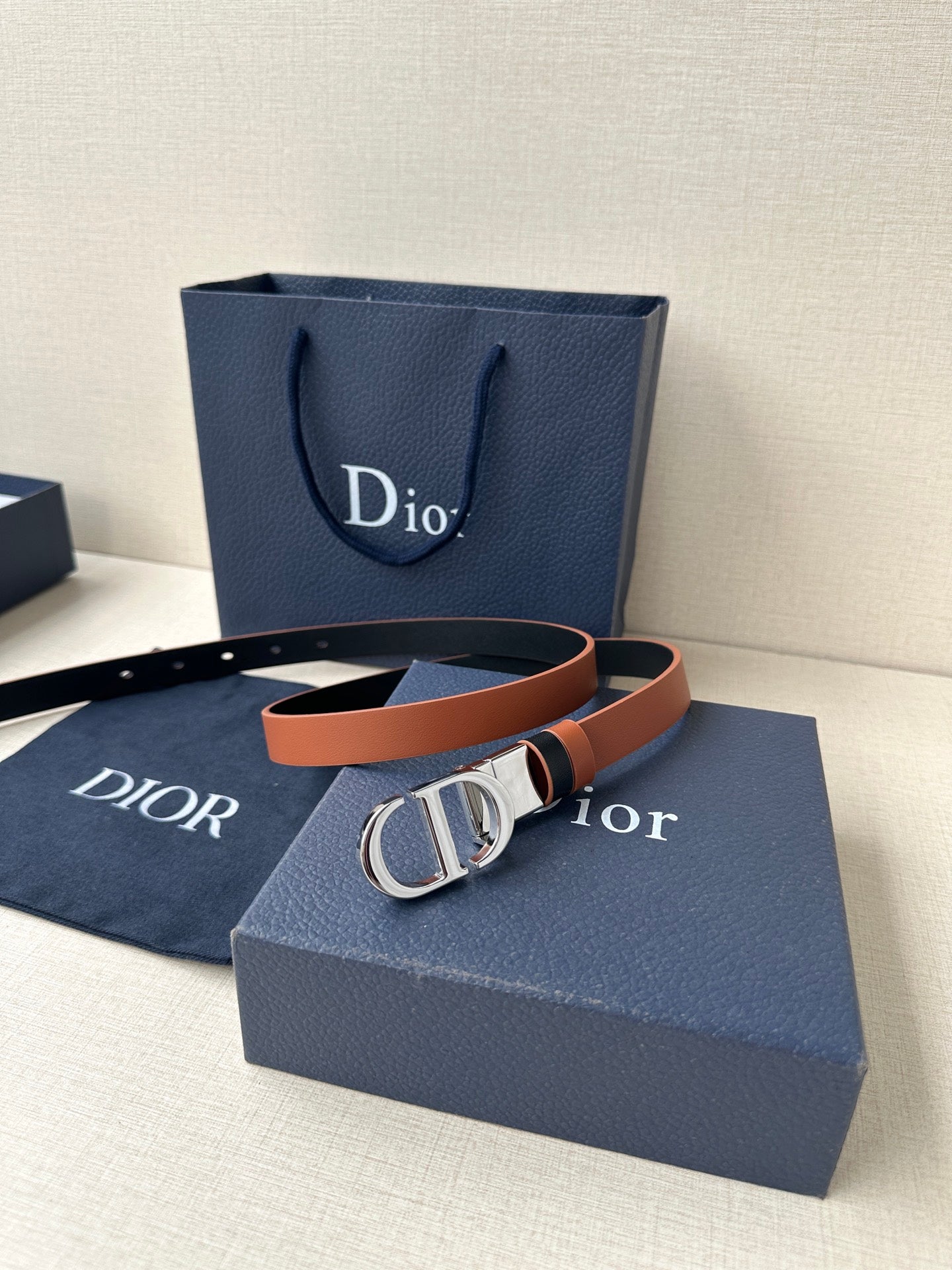 Dior leather belt with tan strap and gold-tone double D buckle