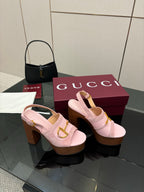 Gucci ladies pink platform heeled sandals with gold buckle strap and open toe