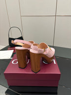 Gucci ladies pink platform heeled sandals, showing side view of wooden block heel
