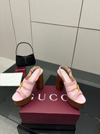 Gucci ladies pink platform heeled sandals pair on box, gold buckle strap visible