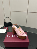Gucci ladies pink platform heeled sandals with gold buckle strap on wooden sole