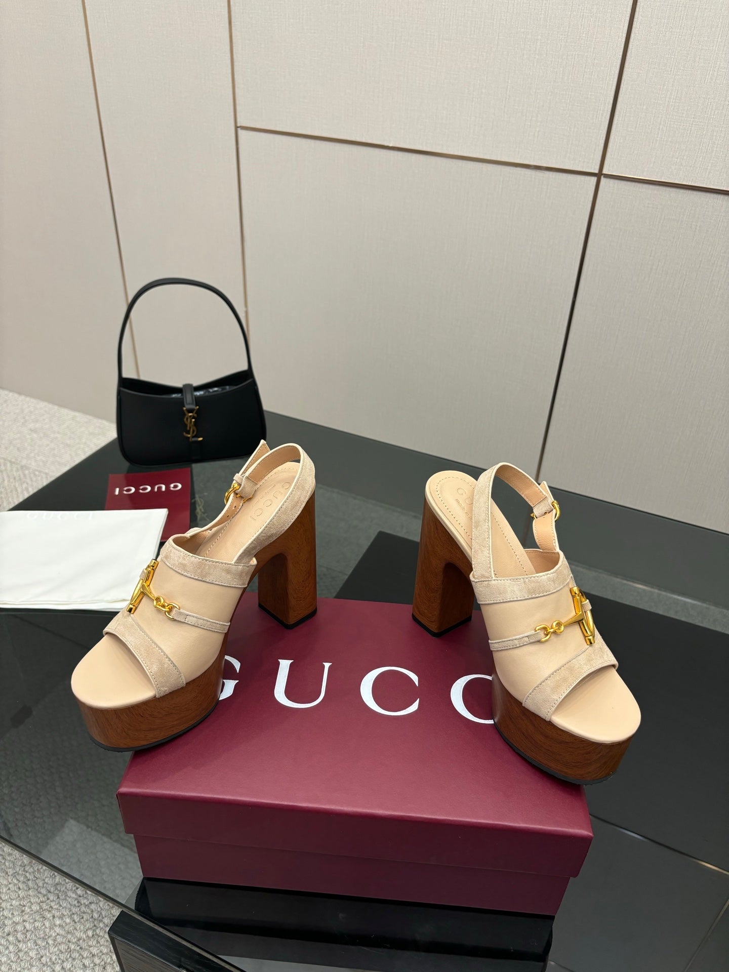 Women's Gucci cream platform mules with gold buckle detailing and tall chunky heel