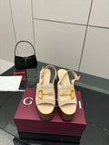 Women's Gucci cream suede platform mules with gold buckle detail and chunky heel