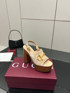 Women's Gucci cream suede platform mules with gold buckle strap and tan block heel