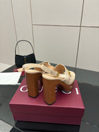 Women's Gucci cream platform mule sandals with gold buckle strap and thick block heel