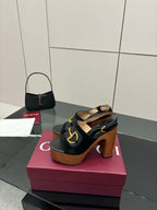 Gucci ladies black heeled sandals with gold-tone buckle detail and chunky wooden heel