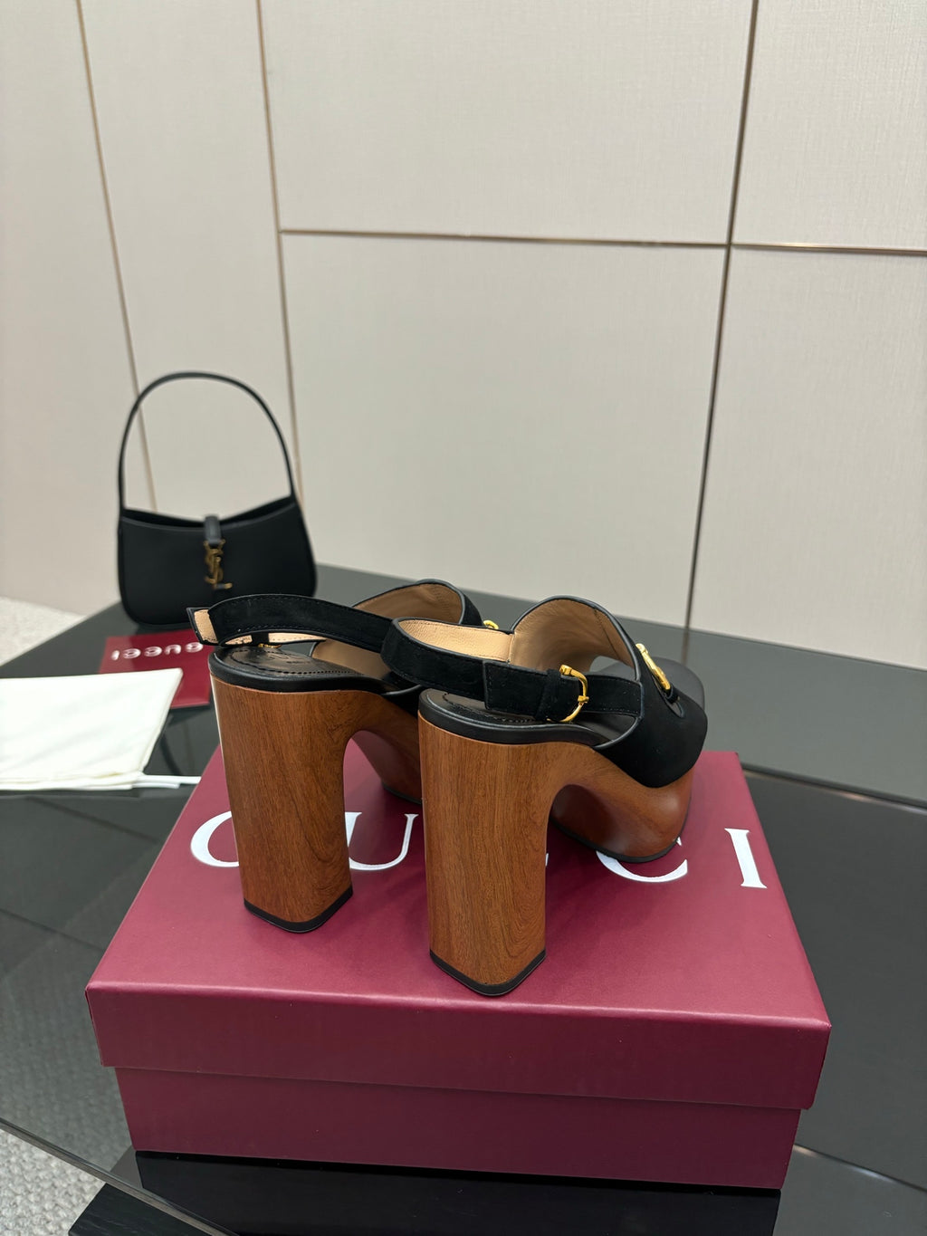 Gucci ladies black heeled sandals with gold buckle strap and stacked wooden heel