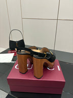 Gucci ladies black heeled sandals with gold buckle strap and stacked wooden heel