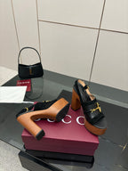 Gucci ladies black heeled sandals with gold buckle strap and wooden platform heel