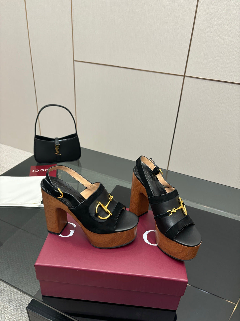 Gucci ladies black heeled sandals with gold buckle strap and tall wooden heel