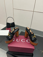 Gucci ladies black heeled sandals with gold buckle strap and chunky wooden heel