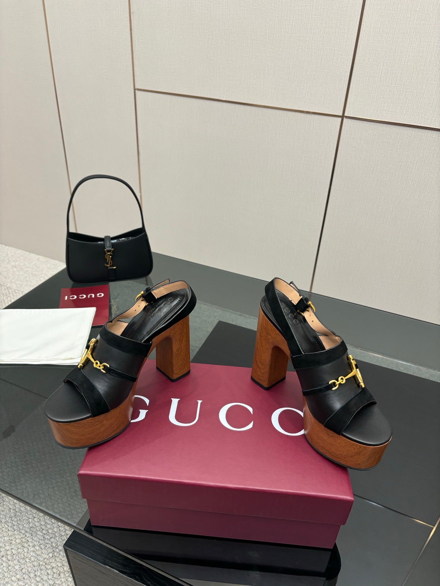Gucci ladies black heeled sandals with gold buckle strap and chunky wooden heel