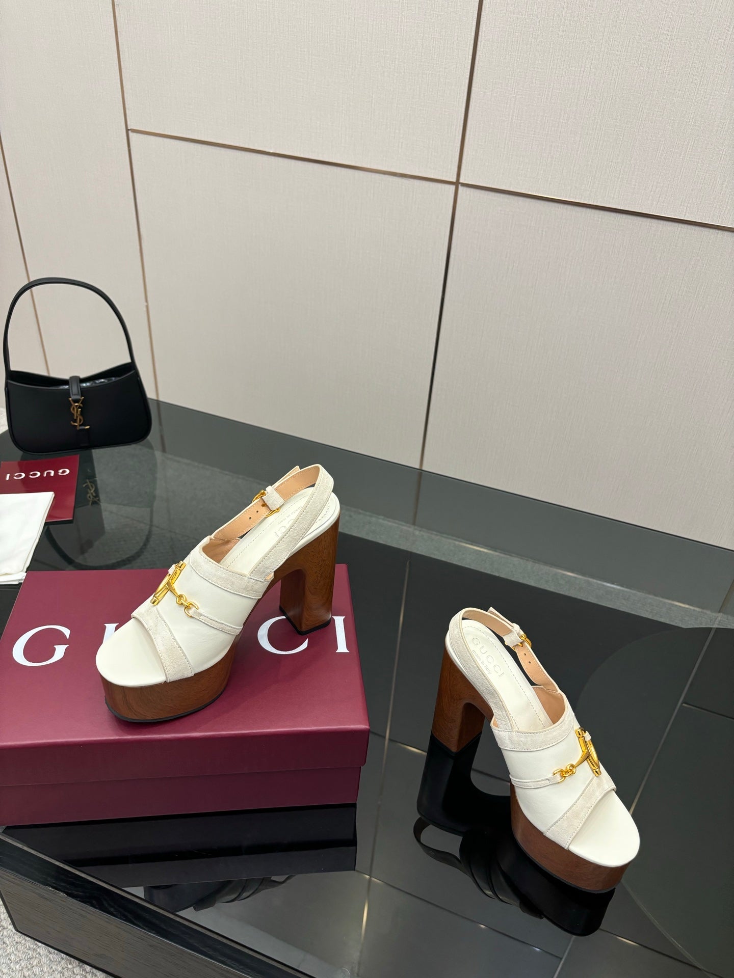 White heeled mules with gold buckle strap and chunky brown platform block heel