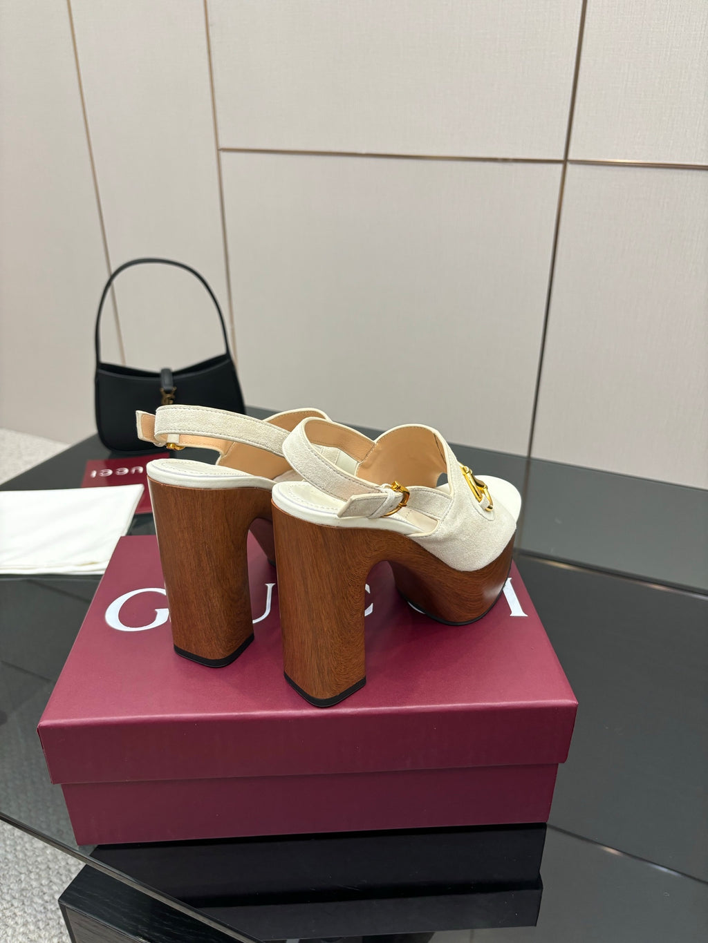 White heeled mules with gold buckle strap and tall chunky brown block heel