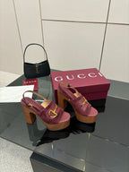 Gucci ladies platform sandals on magenta box, burgundy straps and gold buckle detail