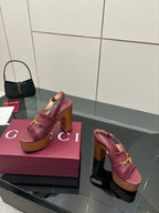 Gucci ladies platform sandals, burgundy slide-on design with gold bit hardware, wood sole