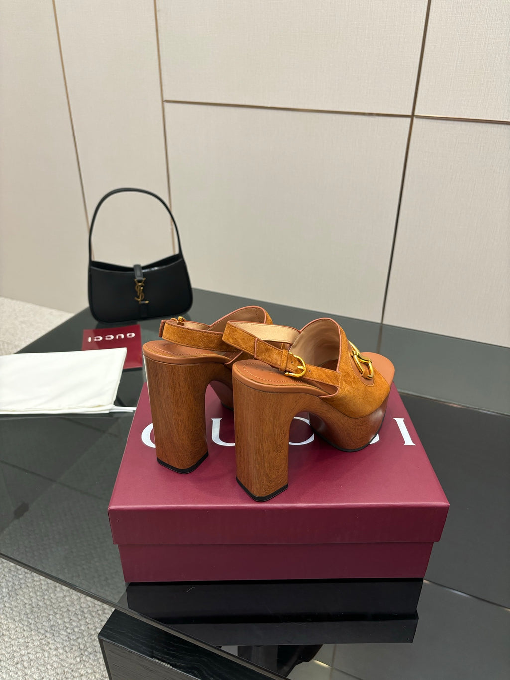 Women’s tan platform mule sandals with gold buckle details and tall block heel