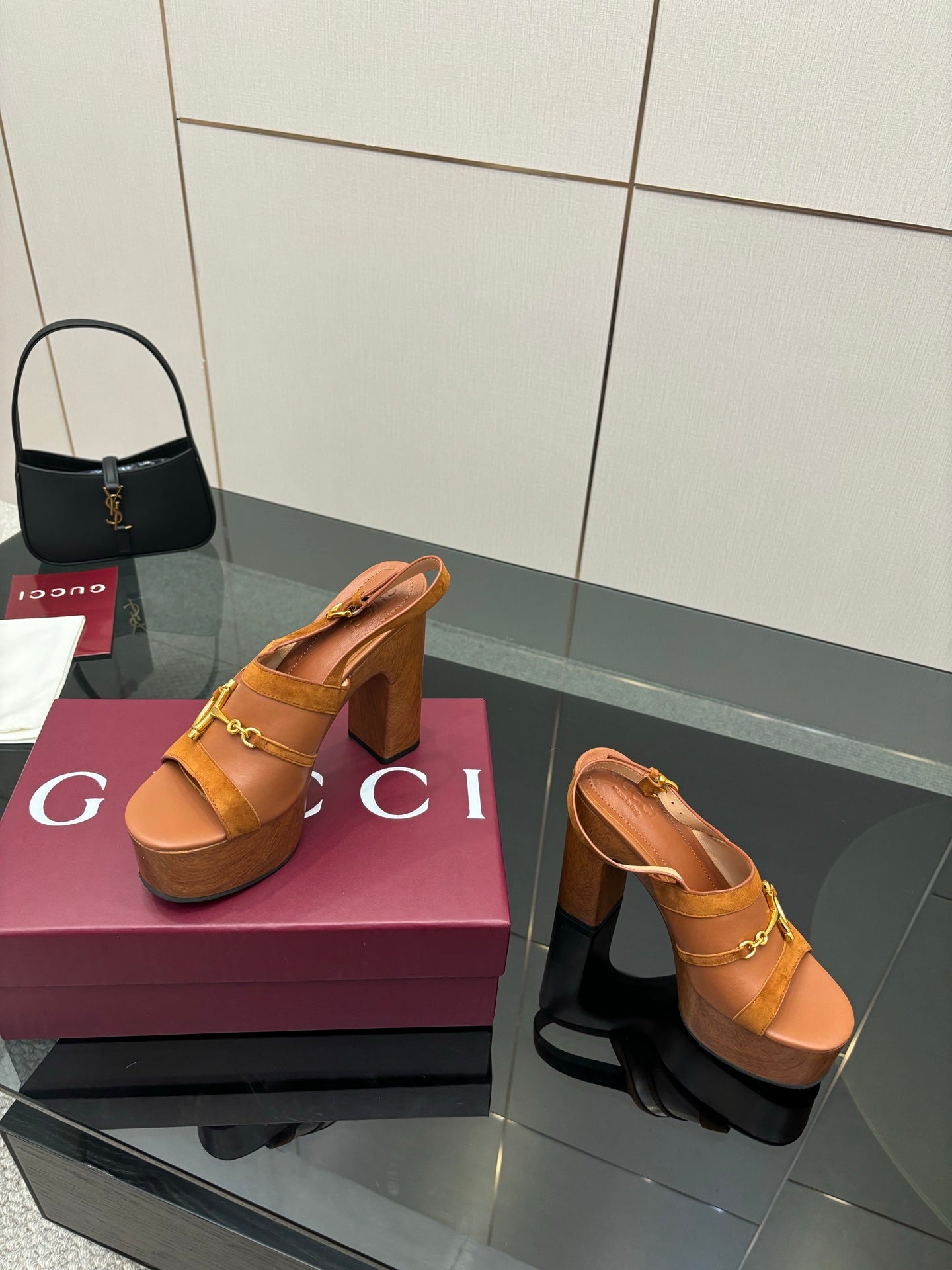 Women’s tan platform mule sandals with gold buckle hardware and tall block heel