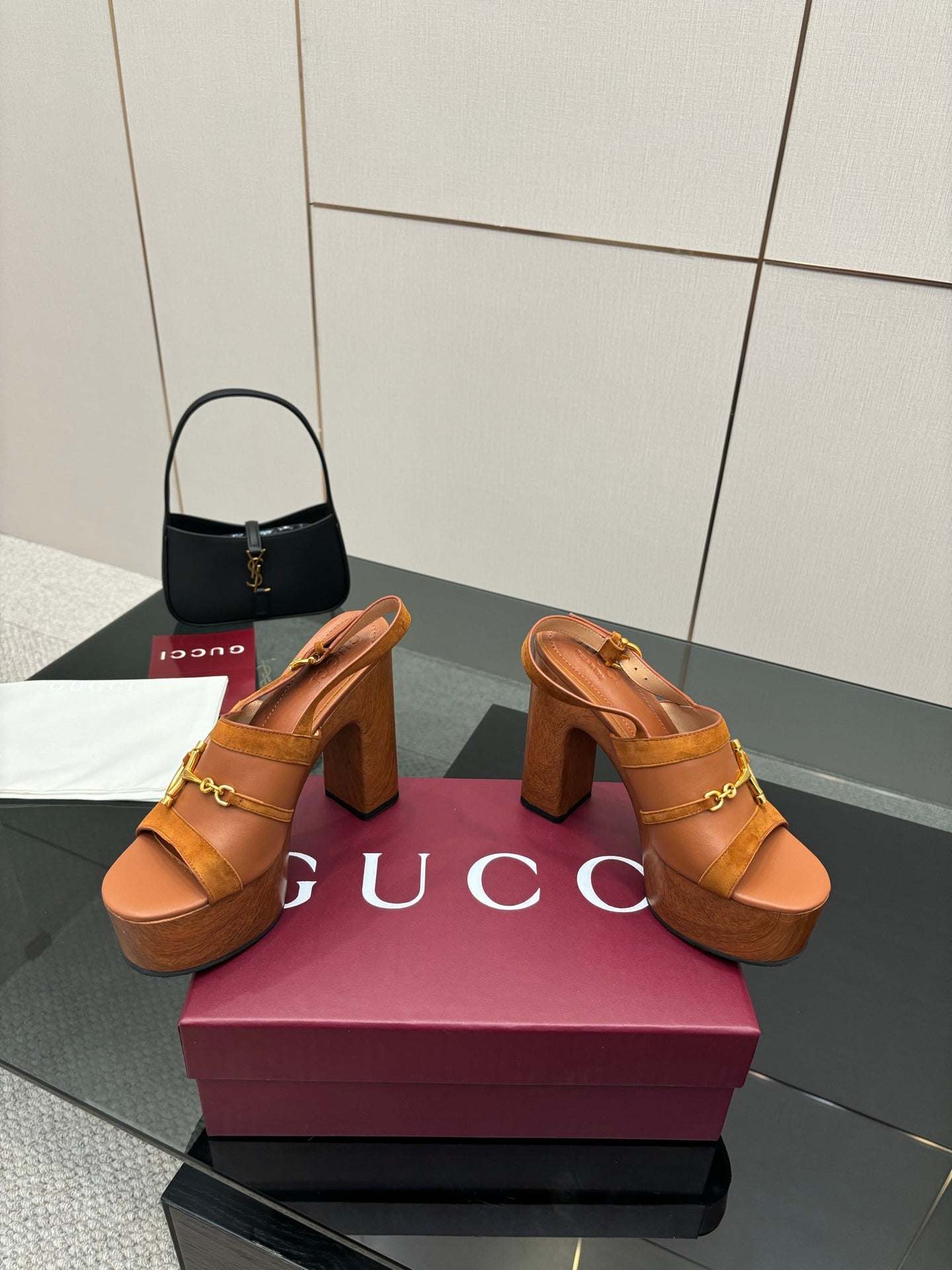 Women’s tan platform mule sandals with gold buckle straps and thick block heels
