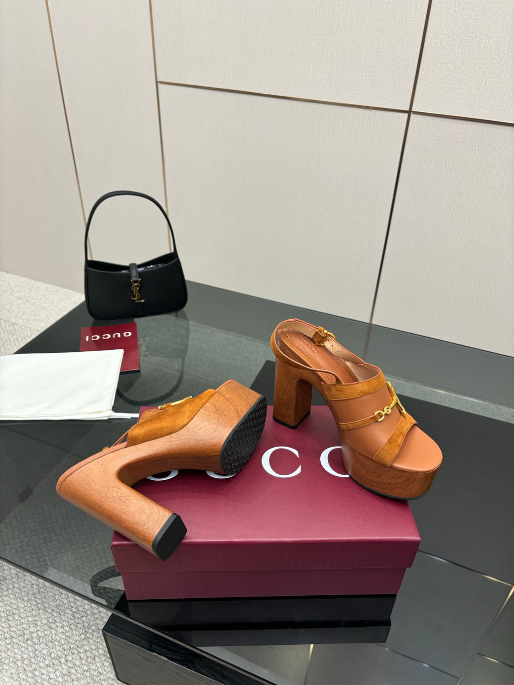 Women’s tan platform mule sandals with gold buckle hardware and chunky block heels