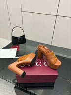 Women’s tan platform mule sandals with gold buckle hardware and chunky block heels