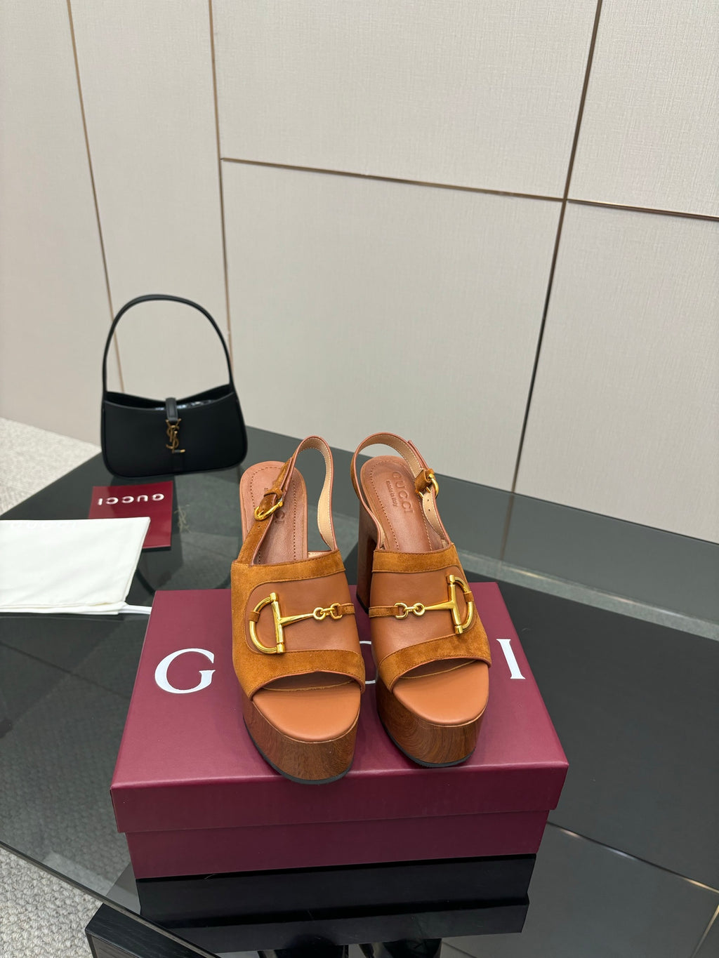 Women’s tan platform mule sandals with gold buckle hardware and chunky block heels