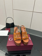 Women’s tan platform mule sandals with gold buckle hardware and chunky block heels