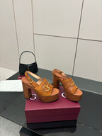 Women’s tan platform mule sandals with gold buckle hardware and chunky block heel