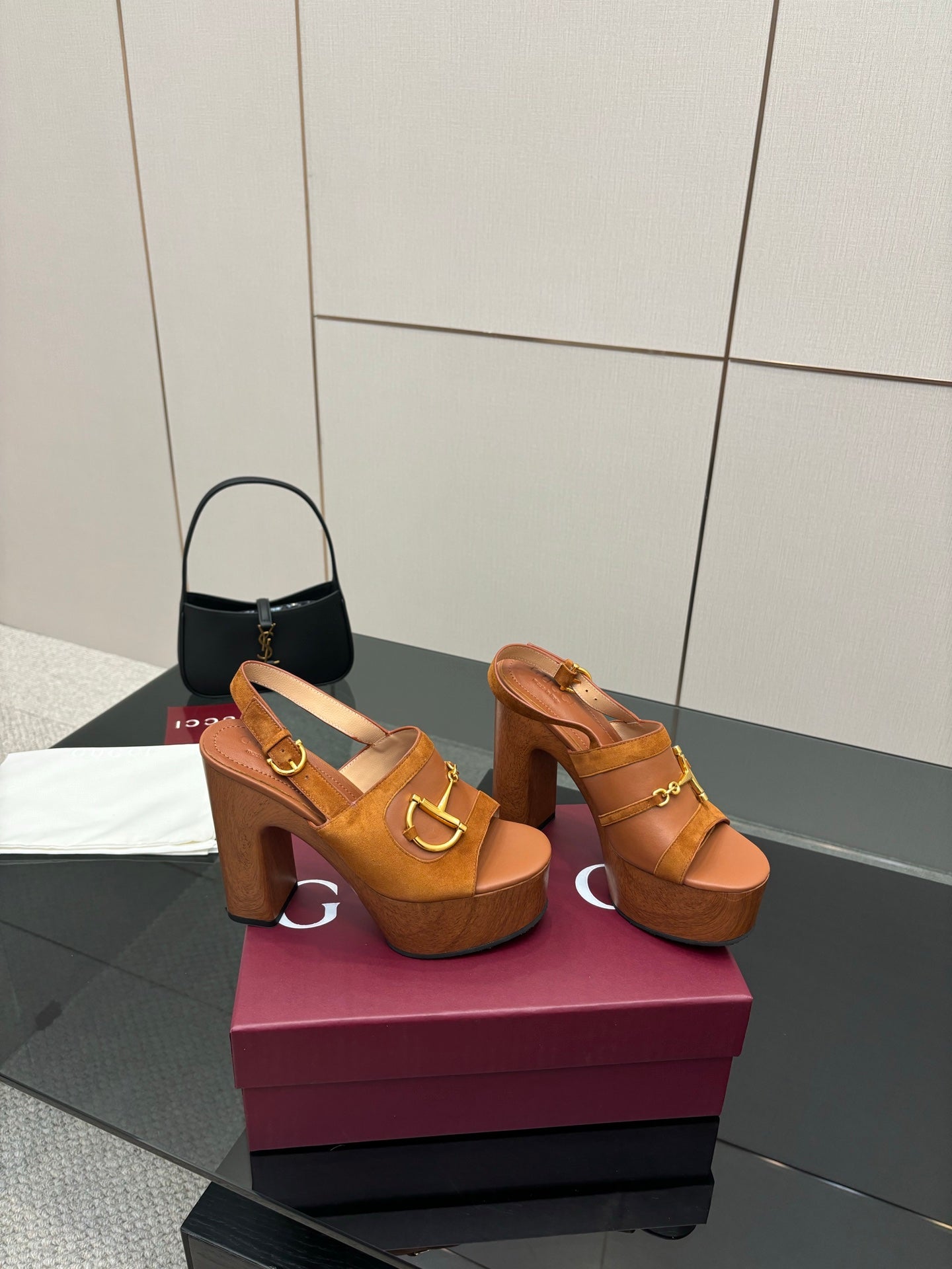 Women’s tan platform mule sandals with gold buckle hardware and chunky block heel