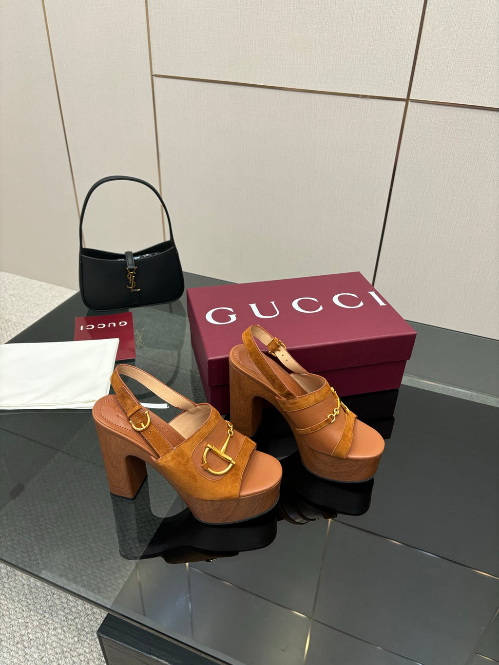 Women’s tan platform mule sandals with gold buckle straps and chunky block heels