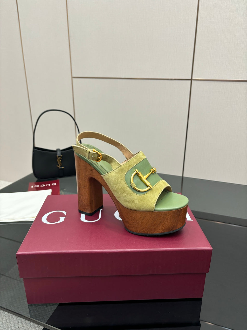 Gucci open-toe platform sandals, lime green with gold buckle, side view on box