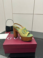 Gucci open-toe platform sandals, lime green with gold buckle, side view on box
