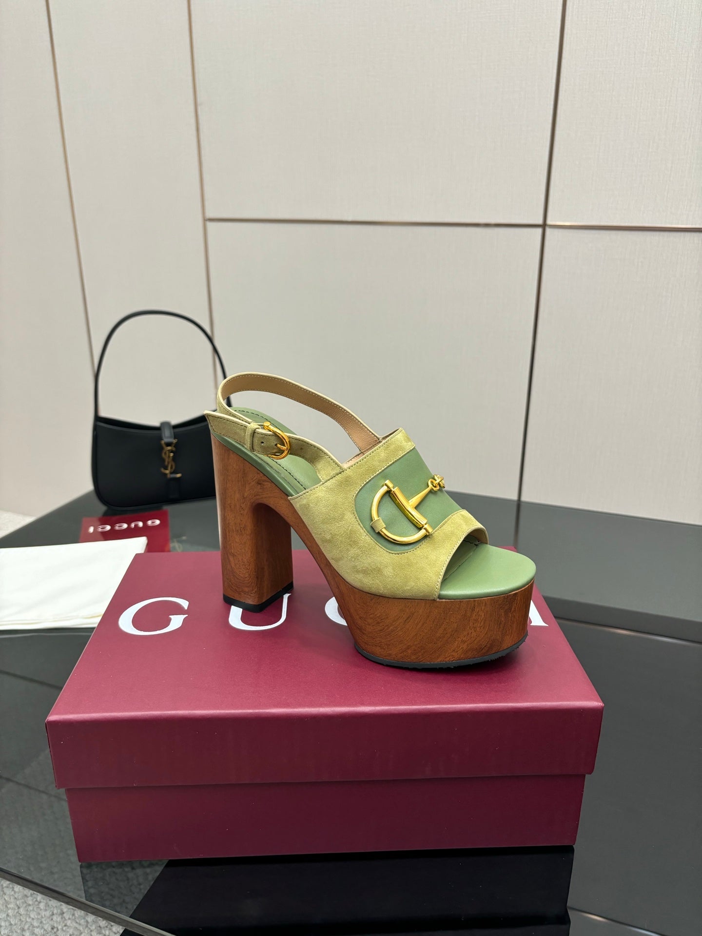 Gucci open-toe platform sandals, lime green with gold buckle, side view on box