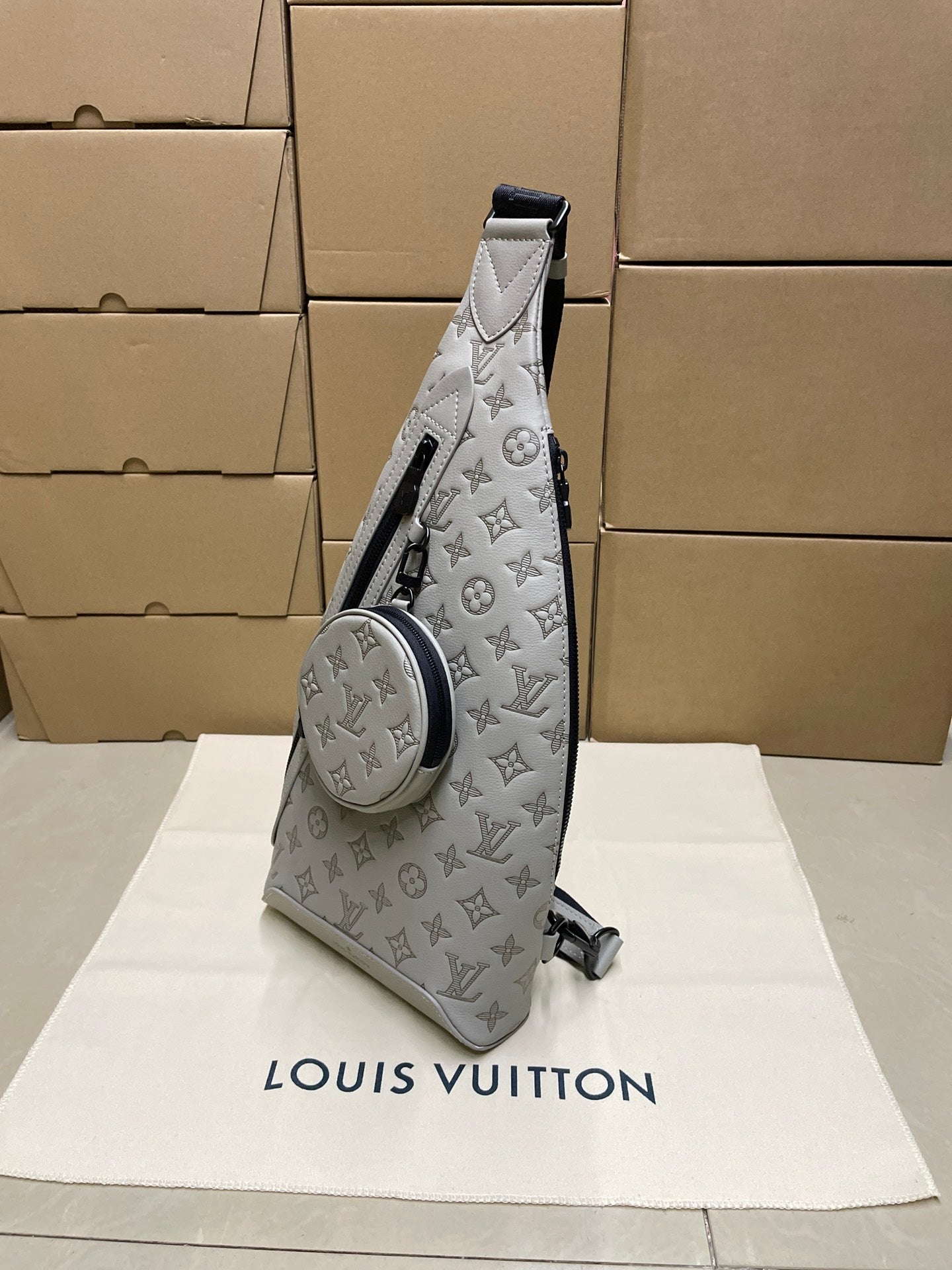 Men's Louis Vuitton monogram sling bag with top handle, light gray/white and dark trim
