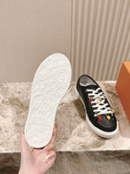 Louis Vuitton unisex sneakers, black upper with white outsole shown