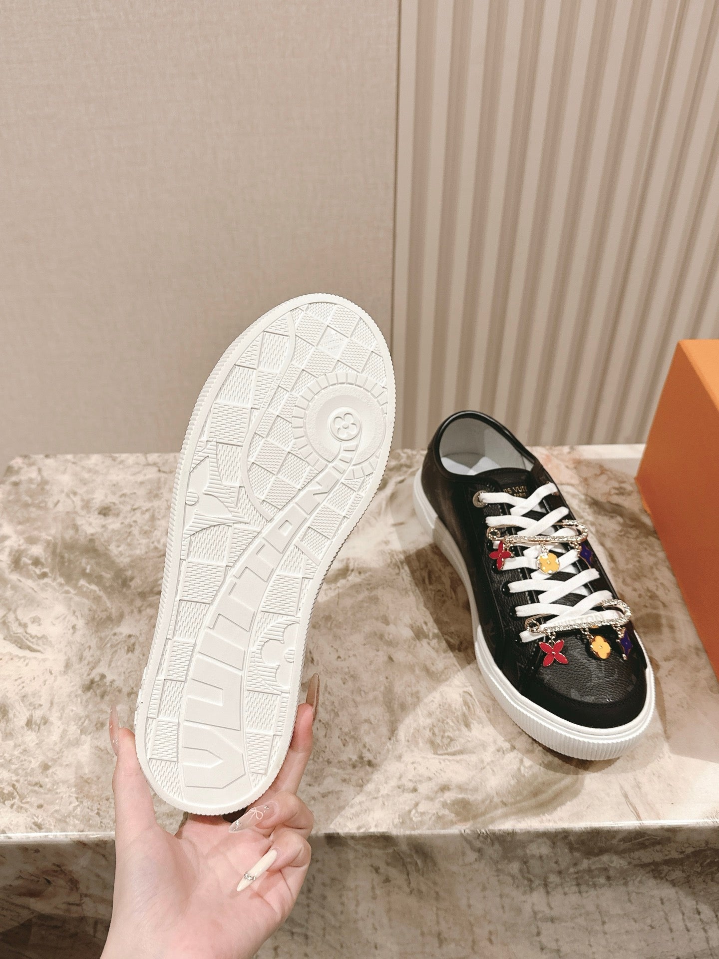 Louis Vuitton unisex sneakers, black upper with white outsole shown