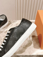 Louis Vuitton unisex sneakers, black leather upper with white contrast sole