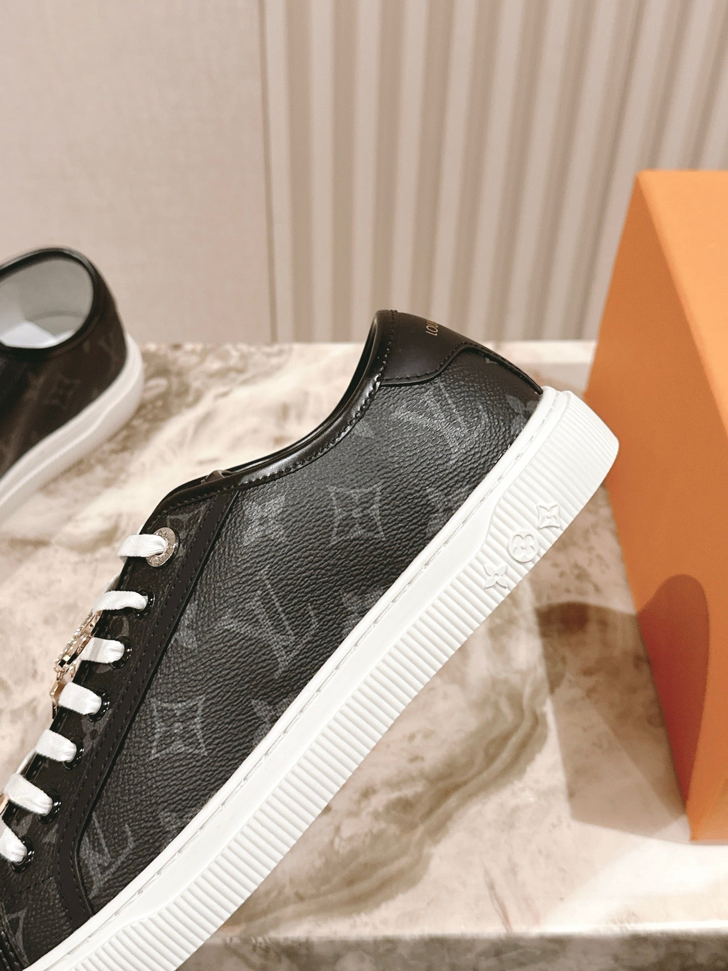 Louis Vuitton unisex sneakers, black leather upper with white contrast sole