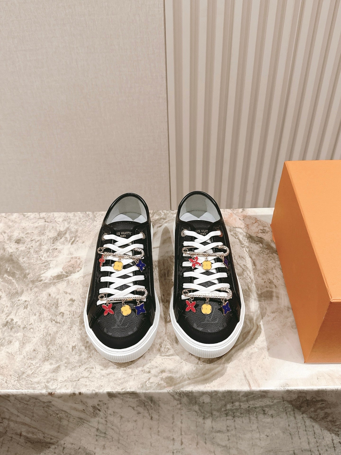 Louis Vuitton unisex sneakers, black with white laces and multicolor charms
