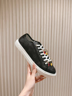Louis Vuitton unisex sneakers, black low-top with white laces and multicolor accents