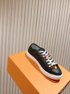 Louis Vuitton unisex sneakers, black on orange box with white sole and charms