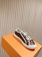 Louis Vuitton low-top sneaker, brown monogram canvas with white laces and colorful motifs