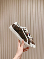 Louis Vuitton low-top sneaker, brown monogram canvas with white sole and white lace-up