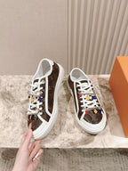 Louis Vuitton low-top sneakers with white laces, brown canvas, side view and colorful motifs