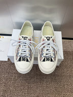 White unisex low-top sneakers with floral print panels and white laces