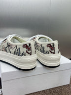 White unisex sneakers with floral print heel and back view on white box