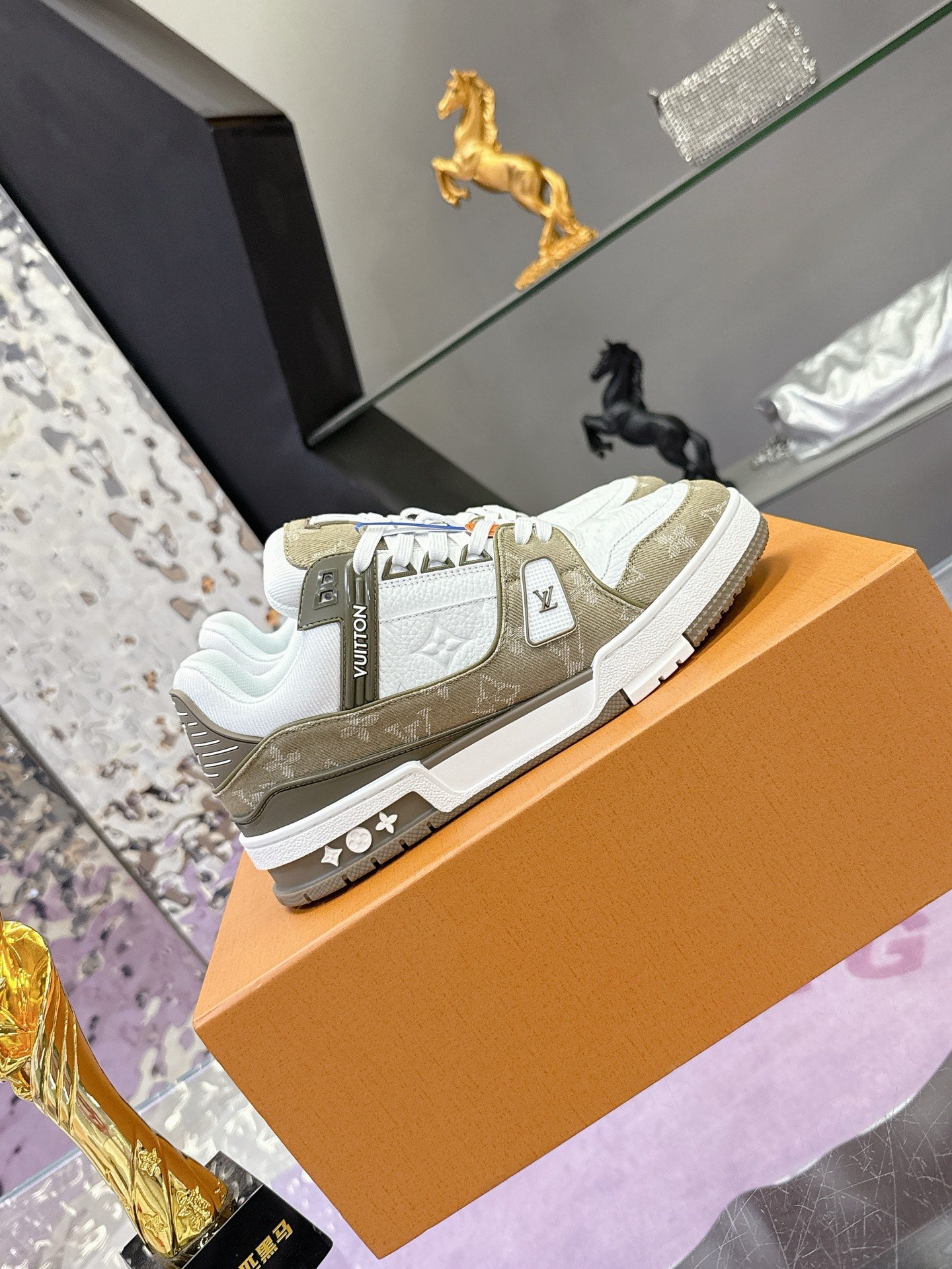 Women’s Louis Vuitton low-top sneakers, white and olive with logo detail and lace-up